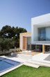 Pool outside modern house