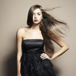 Portrait of young dancing woman with long flowing hair. Fashion Portrait of young dancing woman with long flowing hair. Fashion