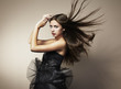 Portrait of young dancing woman with long flowing hair. Fashion Portrait of young dancing woman with long flowing hair. Fashion