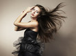 Portrait of young dancing woman with long flowing hair. Fashion Portrait of young dancing woman with long flowing hair. Fashion