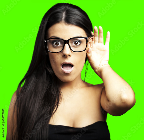 Photo: woman earing a sound over removable chroma key background woman earing a sound over removable chroma key background