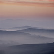 Foggy hills in rural landscape