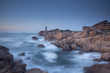 Foto: Lighthouse on rocky coastline Lighthouse on rocky coastline