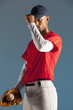Baseball player holding ball in glove