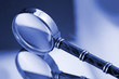 vintage magnifying glass on the mirror surface