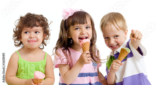 Photo: happy children with ice cream in studio isolated happy children with ice cream in studio isolated
