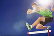 Athlete jumping hurdles