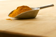 Scoop with curry on a cutting board Scoop with curry on a cutting board