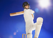 Cricket player swinging bat