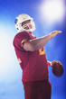 Football player holding ball