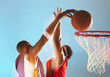 Blurred view of basketball player dunking