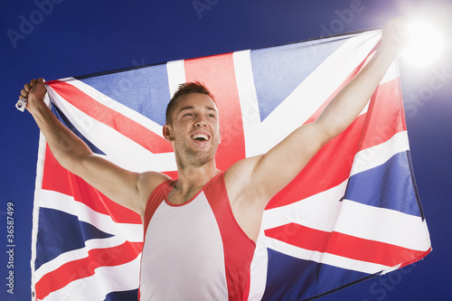 Photo: Athlete carrying Union Jack flag Athlete carrying Union Jack flag