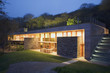 Modern house lit up at twilight