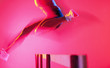Blurred view of athlete jumping hurdle