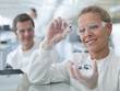 Scientist examining pills in lab