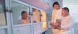 Scientists examining oven in lab