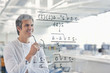 Scientist using touch screen in lab