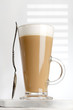coffee latte with frothy milk in tall glass coffee latte with frothy milk in tall glass