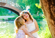 kid girls playing in spring outdoor river park