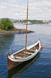 The wooden rowing and sailing boat The wooden rowing and sailing boat