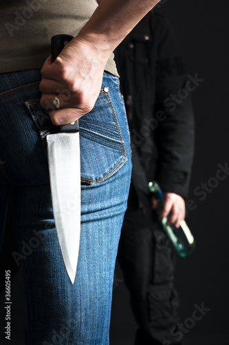 Photo: Woman with a knife. Woman with a knife.