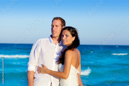 Photo: couple in love hug in blue sea vacation couple in love hug in blue sea vacation