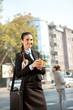 businesswoman going to work with breakfast