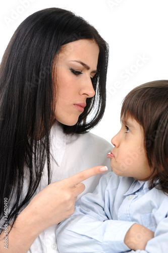 Photo: Boy confronts his mother who is threatening him Boy confronts his mother who is threatening him