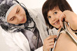Photo: Muslim female doctor in hospital examining a little boy Muslim female doctor in hospital examining a little boy