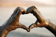 Heart shape, hands with spa mug on