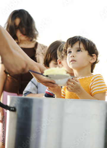 Photo: Hungry children in refugee camp, humanitarian food Hungry children in refugee camp, humanitarian food