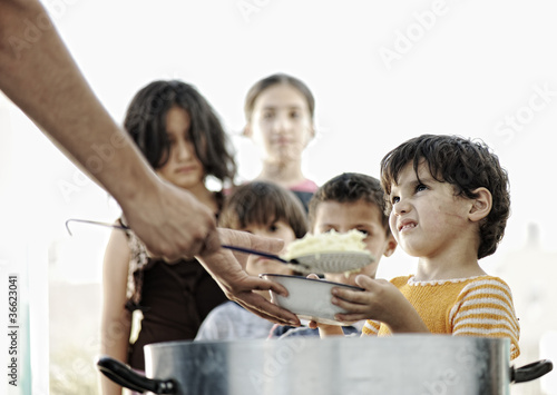 Photo: Hungry children in refugee camp, humanitarian food Hungry children in refugee camp, humanitarian food