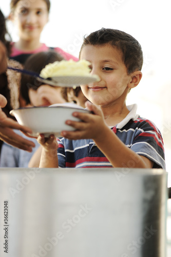 Photo: Hungry children in refugee camp humanitarian food Hungry children in refugee camp humanitarian food
