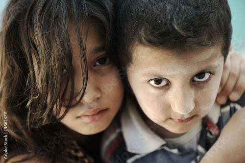 Photo: Little dirty brother and sister, poverty , bad condition Little dirty brother and sister, poverty , bad condition
