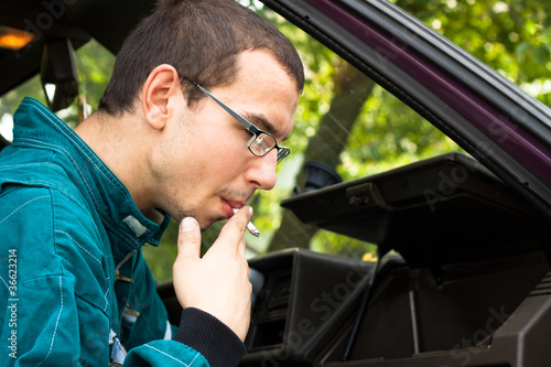 Photo: Man smoking in the car Man smoking in the car