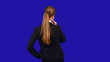 Video: Business woman touching the screen in front of her. Back view. Business woman touching the screen in front of her. Back view.