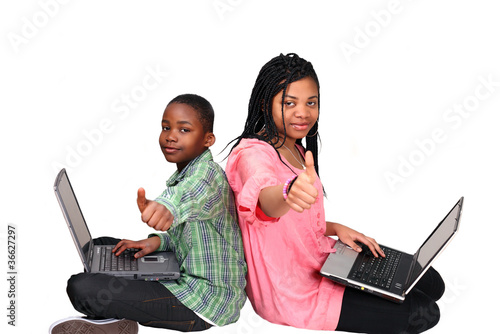 Photo: Thumbs up - cute kids on laptops Thumbs up - cute kids on laptops
