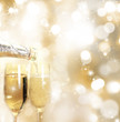 Champagne glasses with golden background