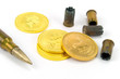 Patrone und Goldmünze