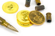 Patrone und Goldmünze