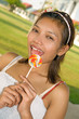 Portrait of beautiful girl with lollipop ..