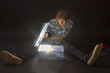 Portrait of a boy looking in a magic lighting box