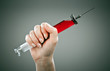 Details der Fotografie Old medical syringe on a grey background