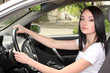 Photo: young brunette woman in new car young brunette woman in new car