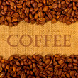 Coffee grains on the burlap background