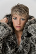 Portrait of pretty woman with real fur jacket