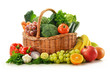 Composition with vegetables and fruits in wicker basket isolated