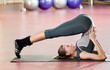 Woman doing stretching fitness exercise at sport gym. Yoga