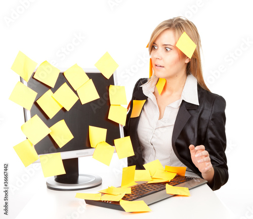 Photo: overworked business woman with stickers on computer overworked business woman with stickers on computer