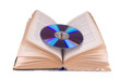 Open book and compact disc isolated on white
